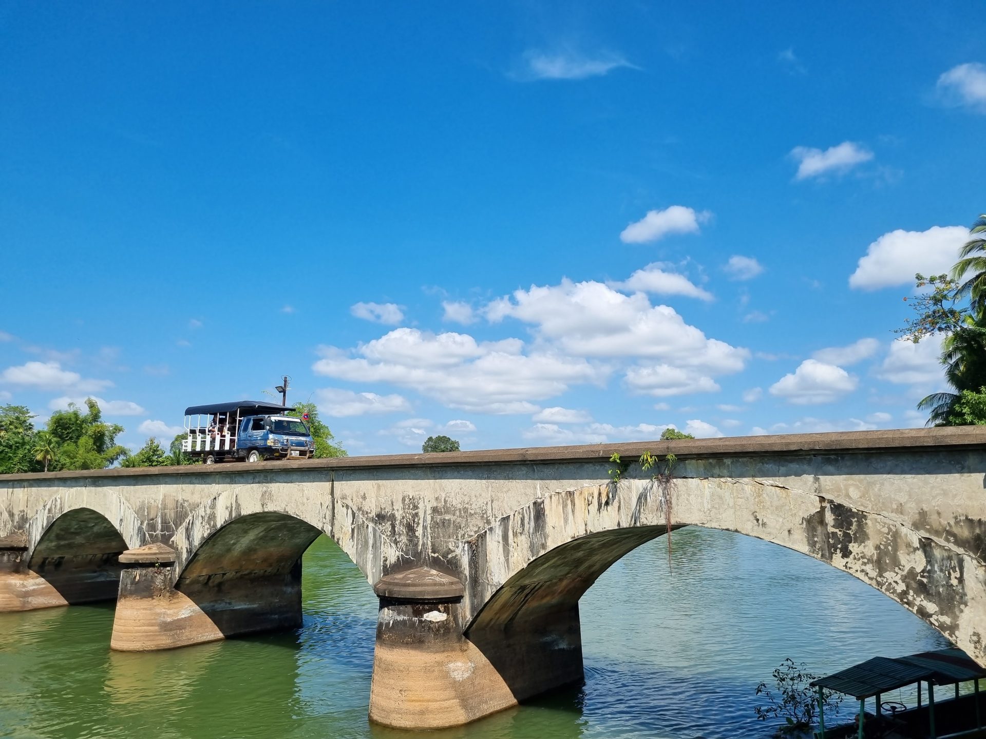 Visit Laos Year 2024 Celebrates Culture And Nature TTR Weekly   DonDet 06 A Local Tourist Vehicle On A Historic Bridge 1920x1440 